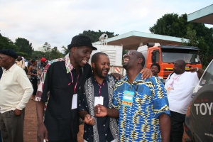 Sam Mataure, centre, manages Tuku Music and also plays the drums. He can tell a good story.
